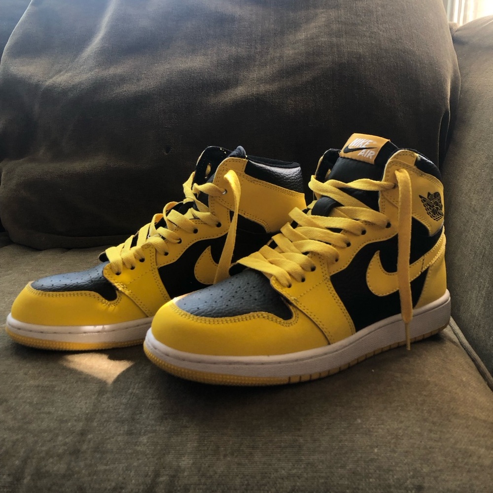Black and yellow Air Jordan 1’s high tops